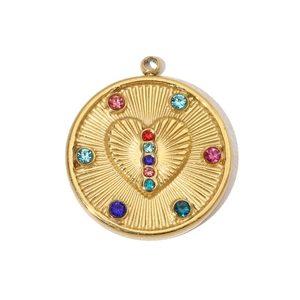 Macro detail of gold-plated stainless steel evil eye heart pendant with colorful gemstones