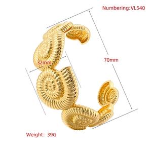 Golden flower seashell style open cuff bracelet with spiral nautical metallic texture