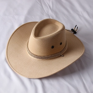 Detail of camel suede cowboy hat featuring metal eyelets and a braided decorative band