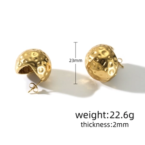 Detail showing 23mm golden water drop earrings with hammered texture and 22.6g weight