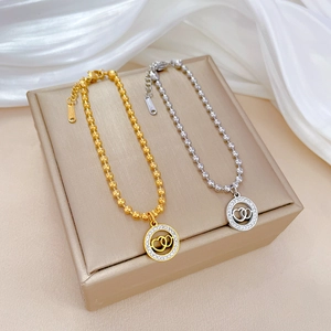 Double heart pendant necklace in gold and silver finish with beaded stainless steel chain
