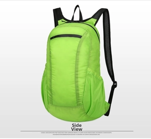 Detail view of lightweight neon green folding backpack with breathable mesh straps