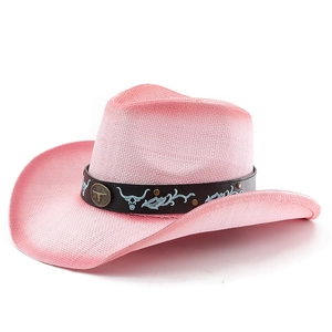 Pink straw cowboy hat with brown leather band and vintage metal bull head emblem