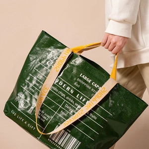 Large capacity green woven shopping bag with yellow handles and modern graphic prints