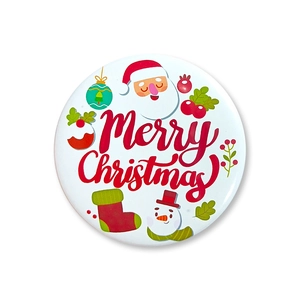 Detail of Christmas tinplate badge featuring Santa and snowman with Merry Christmas text