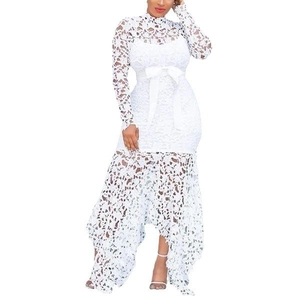 Detail of white lace dress featuring bow belt and asymmetrical hollow-out hemline