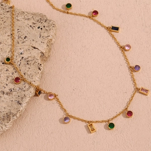 Detailed close-up of 18K gold plated necklace with colorful zircon stones on raw stone