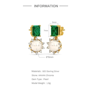 Detail view of s925 silver earrings with green emerald zircon and large round pearls