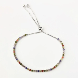 Macro detail of multicolor zircon stones on an adjustable S925 sterling silver bolo bracelet