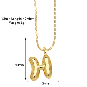 Macro detail of puffy letter H pendant on bead chain with specific dimension labels