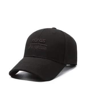 Detailed view of the six-panel black baseball cap with brown embroidered lettering