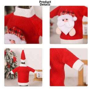 Detail view of red knitted Christmas wine bottle cover with Santa Claus applique and white fur