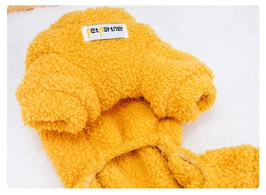 Detailed close-up of yellow sherpa fleece pet hoodie showing stitching and soft texture