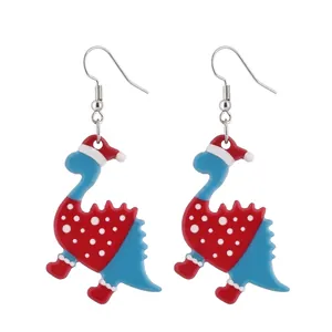 Close-up of acrylic Christmas dinosaur earrings with festive red hats and socks detail