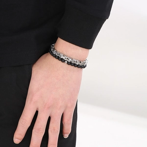 Close-up of a double-layered men's bracelet with silver steel chain and black agate beads