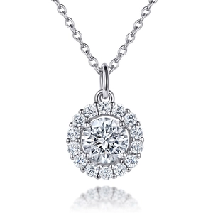Macro shot of silver S925 halo pendant with a central round stone and sparkling gems