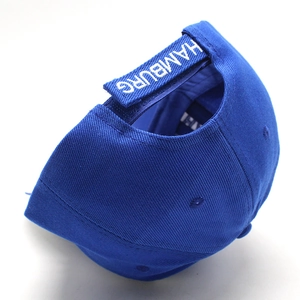 Royal blue baseball cap with white Hamburg embroidery and adjustable velcro strap