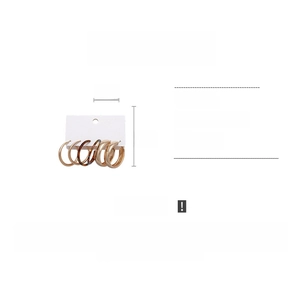 Detail view of 4cm round acetate and gold metal hoop earrings set on display card