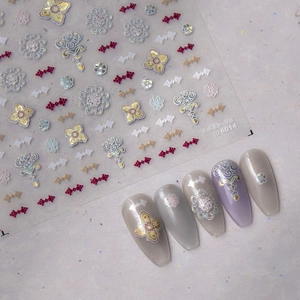 Detailed 3D relief nail stickers with baroque floral patterns and iridescent finishes