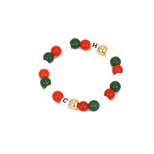 Colorful beaded bracelet with red green pearls and gold accents for festive styling