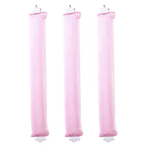 Three-piece pink velvet heatless hair curlers with metal buckles on white background