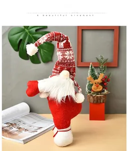 Close-up of a plush Christmas gnome with red reindeer knit hat and white faux fur beard