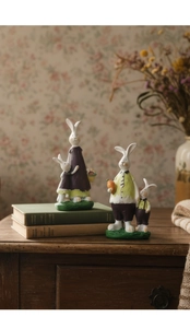 Detailed close-up of vintage resin rabbit figurines with hand-painted textures