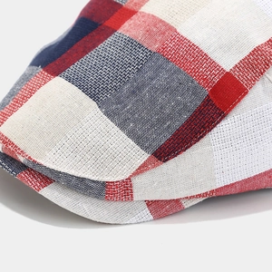 Macro shot of British style plaid beret showing high-quality stitching and woven fabric