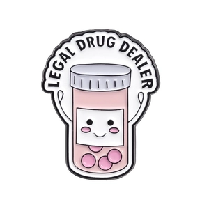 Pink cartoon medicine bottle enamel pin with Legal Drug Dealer text on white background