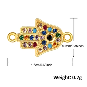 Detailed view of 18k gold plated Hamsa hand connector with colorful cubic zirconia stones