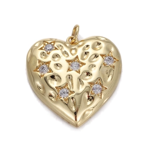 Close-up of heart-shaped gold charm with hammered texture and star-set zirconias