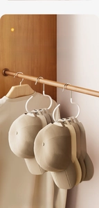 Space-saving baseball cap storage hook featuring C-shape design to prevent deformation