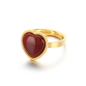 Fashionable gold stainless steel ring with a red heart-shaped gemstone and rope edge