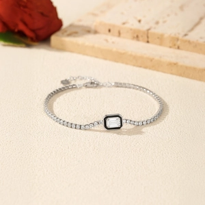 Elegant S925 silver tennis bracelet with black enamel and emerald-cut crystal centerpiece