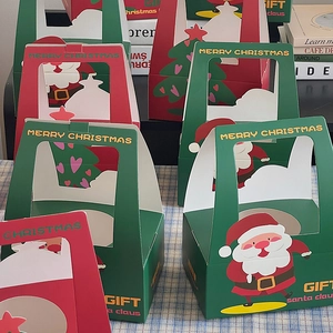 Detailed view of red and green Christmas gift boxes with Santa and tree motifs