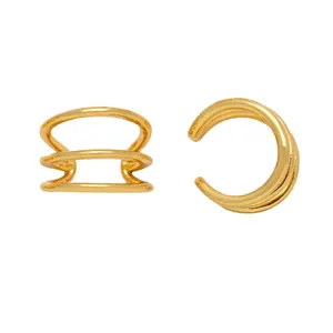 Macro shot of gold geometric irregular ear cuff with triple-layered parallel ring design