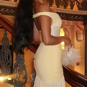 Detailed side view of yellow off-shoulder bodycon dress with elegant ruched mesh splicing