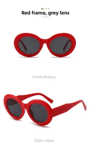 Detailansicht der Vintage-Sonnenbrille mit rotem ovalem Rahmen und grauen Gläsern