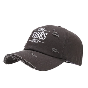 Distressed black baseball cap with Good Vibes Only embroidery shown from 45-degree angle