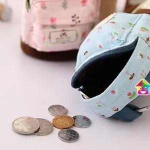 Mini floral canvas coin purse in backpack shape with zipper closure and hanging hook