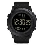Close-up of black digital sports watch with textured strap and negative display screen