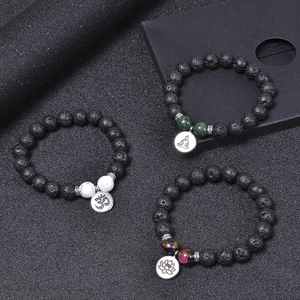 10mm black lava stone yoga bracelet set with lotus and OM charm pendants