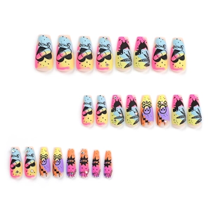 Colorful gradient press-on nails with skull, heart, and rhinestone in long coffin shape
