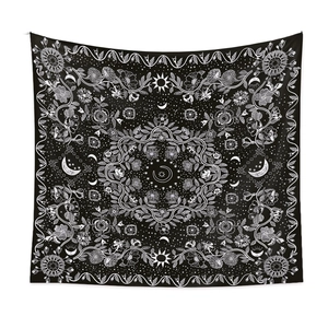 Detailed macro view of bohemian mandala tapestry featuring celestial sun and moon patterns