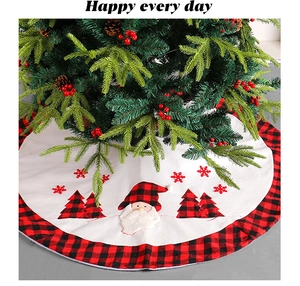 Detail showing plush Santa Claus and buffalo plaid border on the Christmas tree skirt