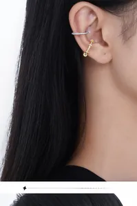 Close-up of minimalist S925 sterling silver ear cuffs with micro-pave cubic zirconia