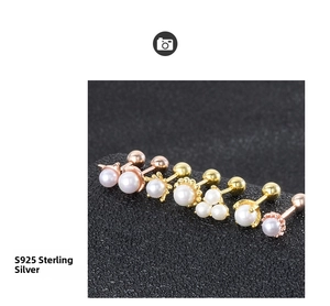 Macro view of S925 sterling silver mini pearl ear studs with screw backs in gold finishes
