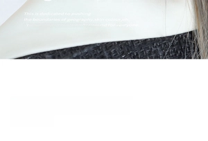 Detailed view of mixed texture design featuring black knit and white satin fabric contrast