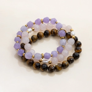 Detailed set of three natural amethyst, quartz and tiger eye beaded bracelets with pearls