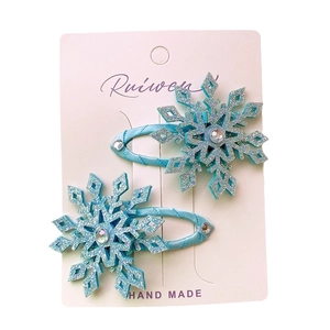 Blue glitter snowflake hair clips with crystal center for little girls on white card